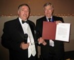 Ray Librock presents Grand Knight Mike Carroll with a congratulatory letter from Supreme Council Headquarters in New Haven Connecticut.